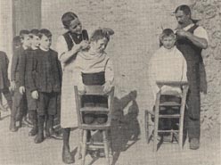 Next! Boys having a haircut at Sampford Peverell